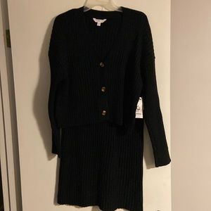 Sweater skirt set large. 12/14 in size. Black with brown buttons. Never worn.